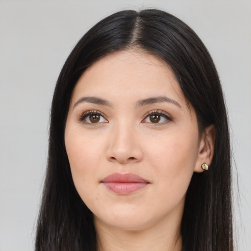 Joyful white young-adult female with long  black hair and brown eyes