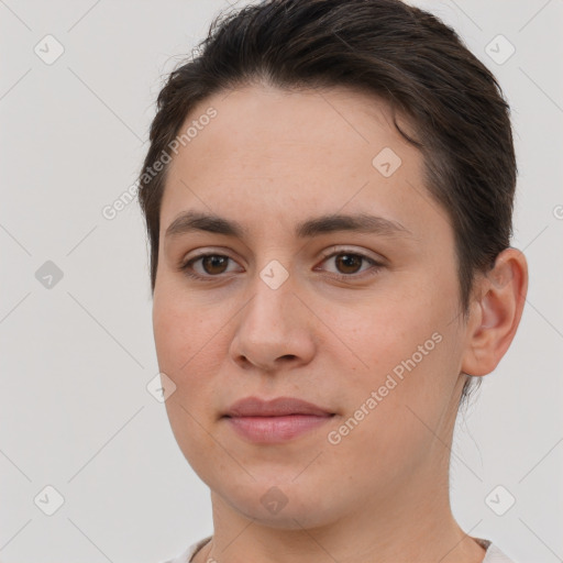 Joyful white young-adult female with short  brown hair and brown eyes