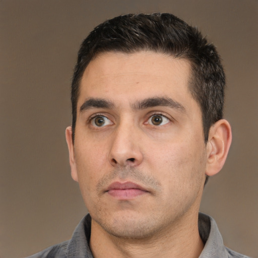 Neutral white young-adult male with short  black hair and brown eyes