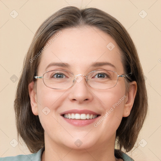 Joyful white adult female with medium  brown hair and grey eyes