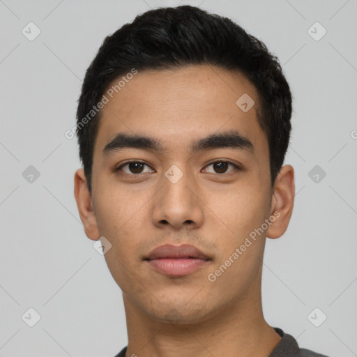 Neutral latino young-adult male with short  black hair and brown eyes