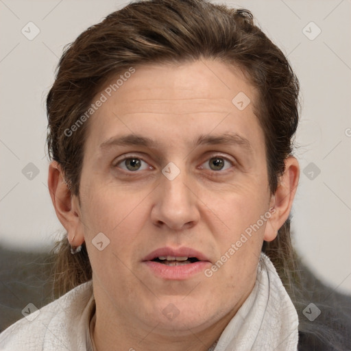 Joyful white adult male with short  brown hair and grey eyes