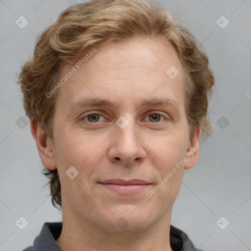 Joyful white adult male with short  brown hair and grey eyes