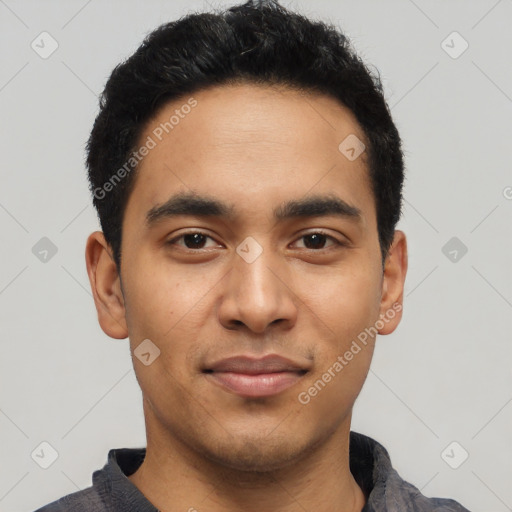 Joyful latino young-adult male with short  black hair and brown eyes