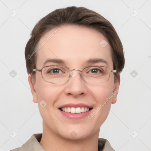 Joyful white adult female with short  brown hair and grey eyes