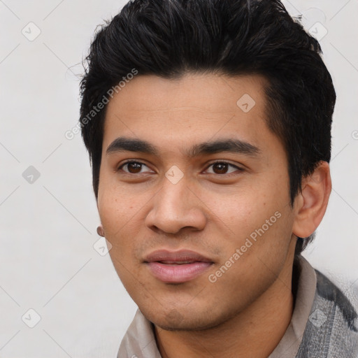 Joyful asian young-adult male with short  black hair and brown eyes