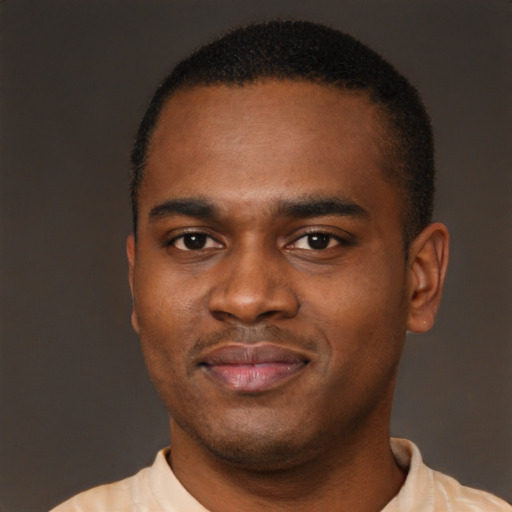Joyful latino young-adult male with short  brown hair and brown eyes