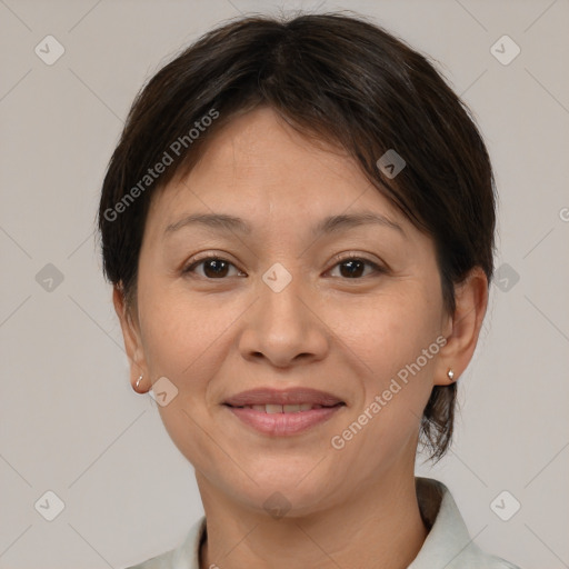 Joyful white adult female with short  brown hair and brown eyes