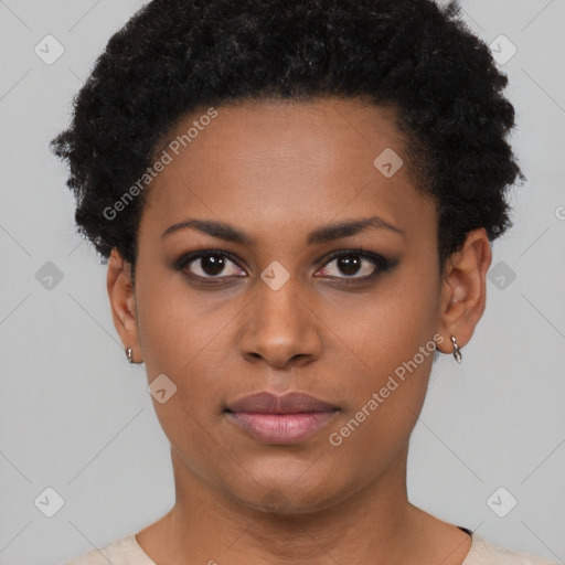 Joyful black young-adult female with short  black hair and brown eyes