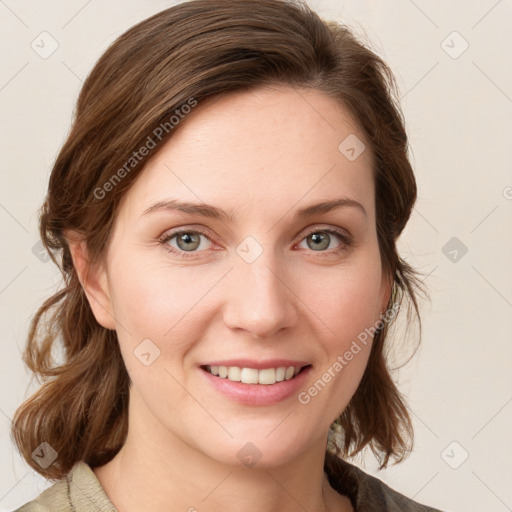 Joyful white young-adult female with medium  brown hair and blue eyes