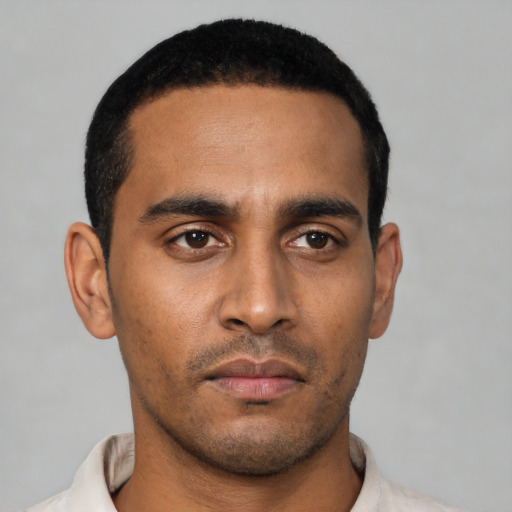 Neutral latino young-adult male with short  black hair and brown eyes