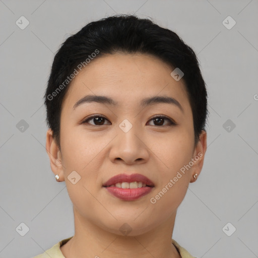 Joyful asian young-adult female with short  black hair and brown eyes