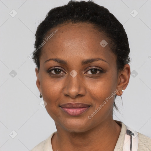 Joyful black young-adult female with short  black hair and brown eyes