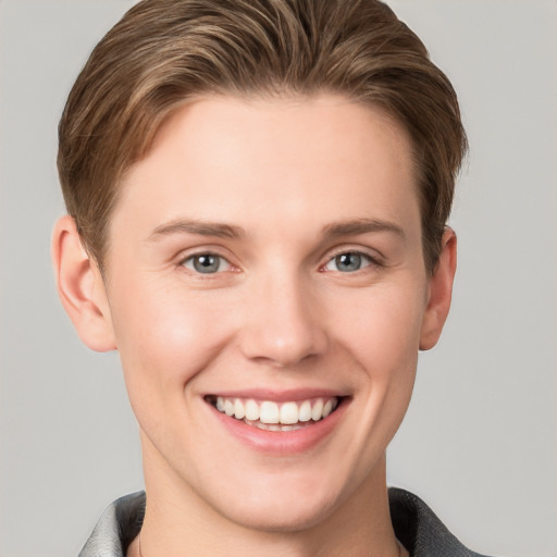 Joyful white young-adult female with short  brown hair and grey eyes