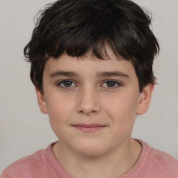 Joyful white child male with short  brown hair and brown eyes