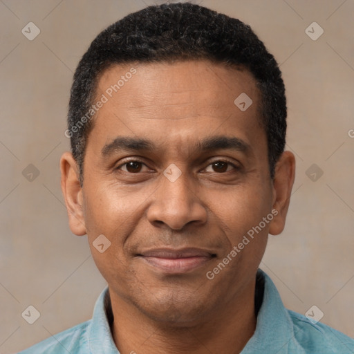 Joyful black adult male with short  black hair and brown eyes