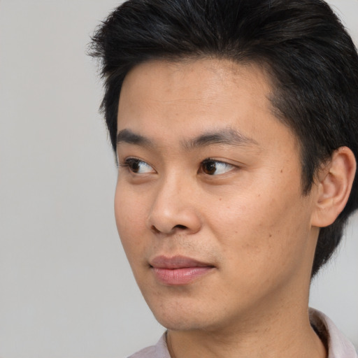 Neutral asian young-adult male with short  black hair and brown eyes