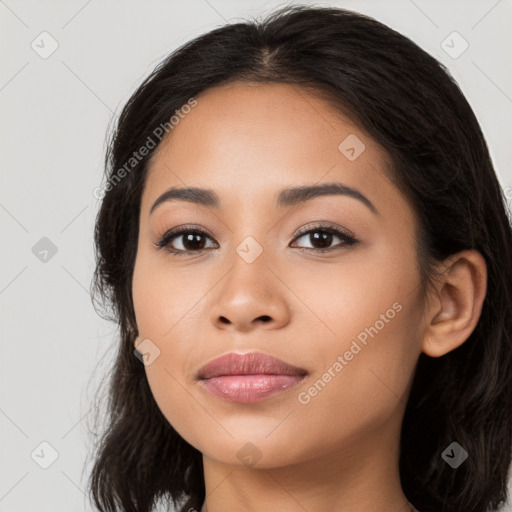 Joyful latino young-adult female with long  black hair and brown eyes