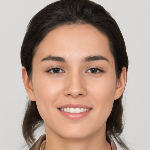 Joyful white young-adult female with medium  brown hair and brown eyes