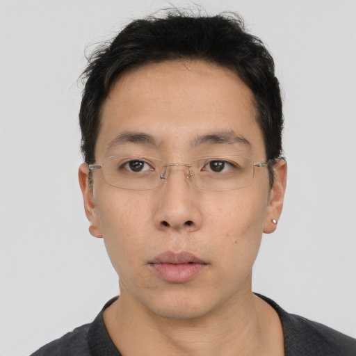 Neutral white young-adult male with short  black hair and brown eyes
