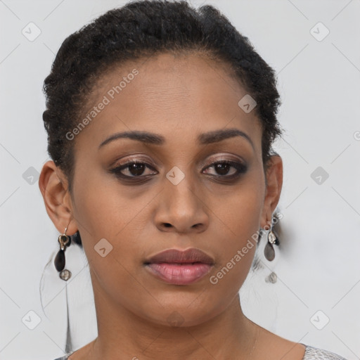 Joyful black young-adult female with short  brown hair and brown eyes