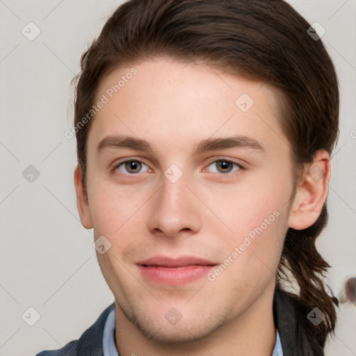 Neutral white young-adult male with short  brown hair and grey eyes