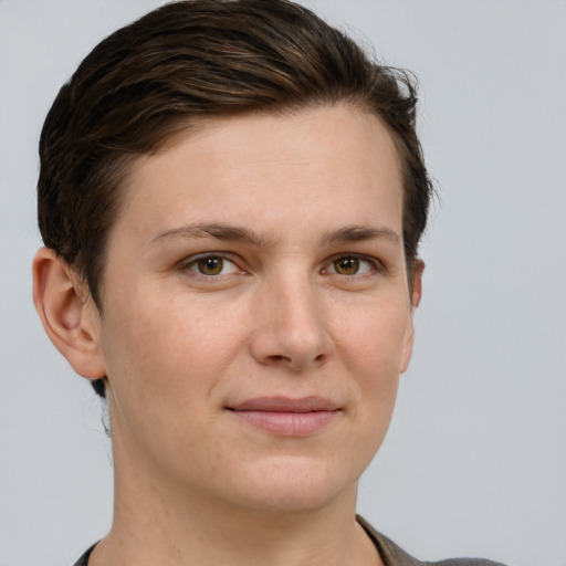 Joyful white young-adult female with short  brown hair and grey eyes