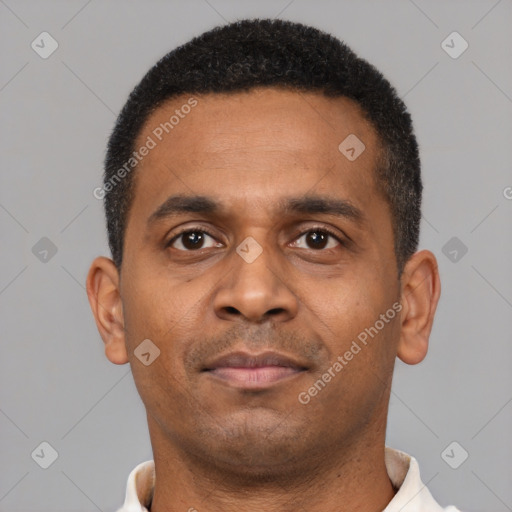 Neutral latino young-adult male with short  black hair and brown eyes