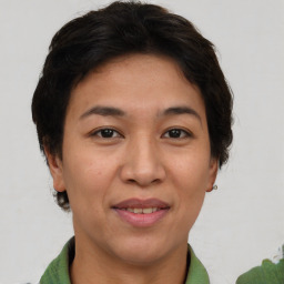 Joyful asian adult female with short  brown hair and brown eyes