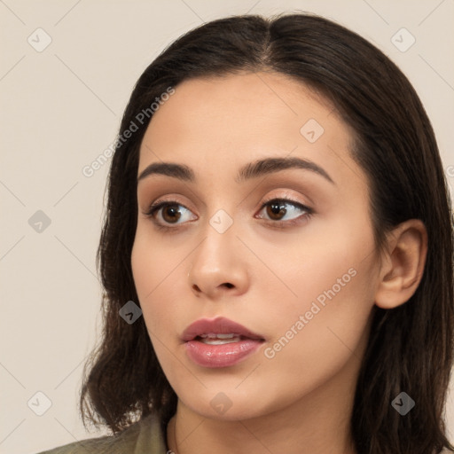 Neutral white young-adult female with long  brown hair and brown eyes