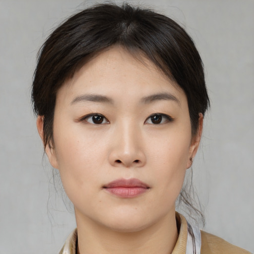 Neutral asian young-adult female with medium  brown hair and brown eyes