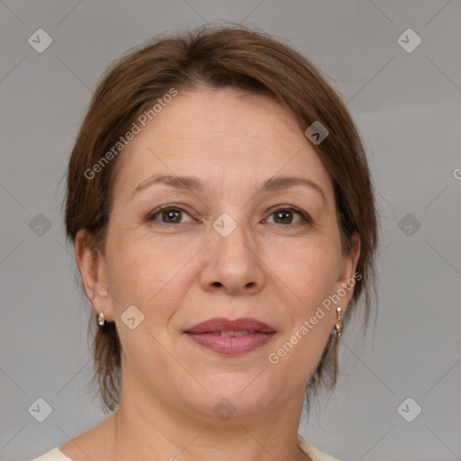 Joyful white adult female with medium  brown hair and brown eyes