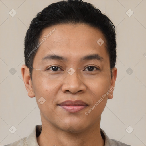 Joyful latino young-adult male with short  black hair and brown eyes