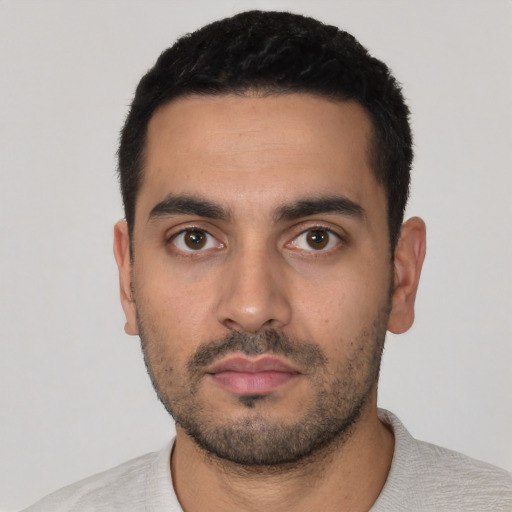 Neutral latino young-adult male with short  black hair and brown eyes