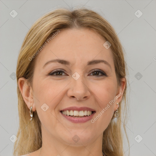 Joyful white adult female with long  brown hair and brown eyes