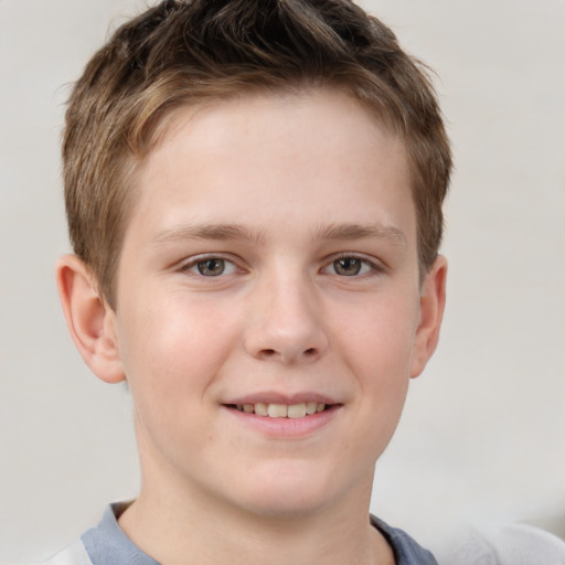 Joyful white child male with short  brown hair and brown eyes