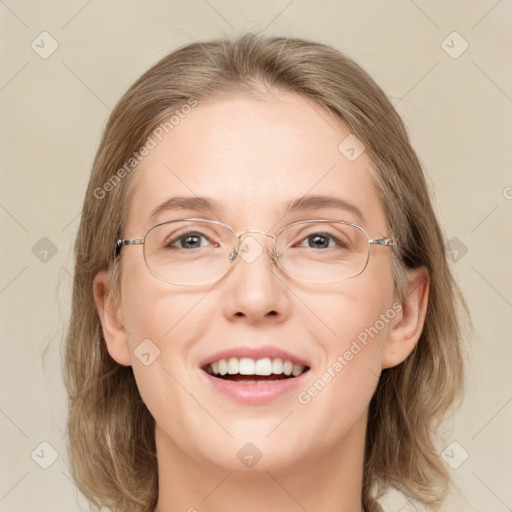 Joyful white adult female with medium  brown hair and green eyes