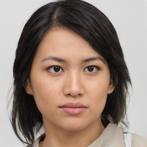 Neutral asian young-adult female with medium  black hair and brown eyes