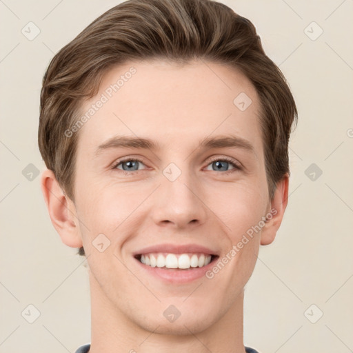 Joyful white young-adult male with short  brown hair and grey eyes