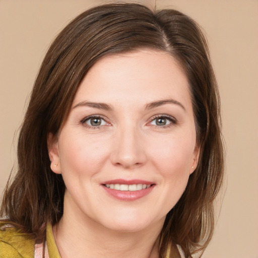 Joyful white young-adult female with medium  brown hair and brown eyes