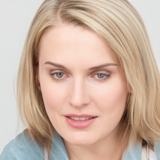 Joyful white young-adult female with medium  brown hair and blue eyes