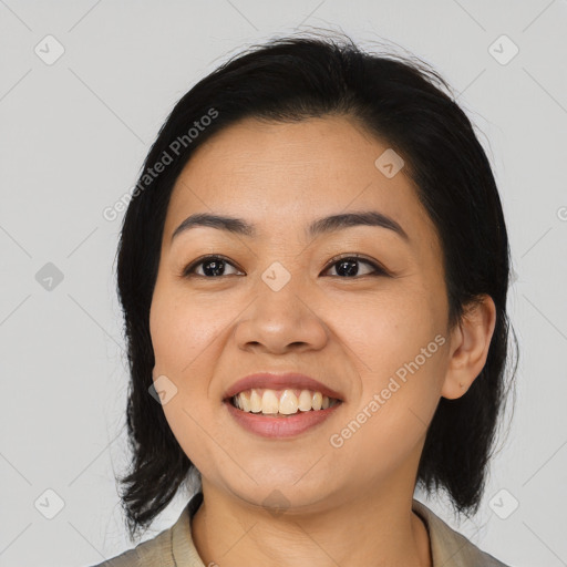 Joyful asian young-adult female with medium  black hair and brown eyes