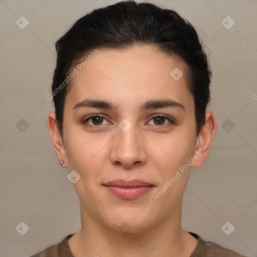 Joyful white young-adult female with short  brown hair and brown eyes