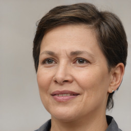 Joyful white adult female with short  brown hair and brown eyes