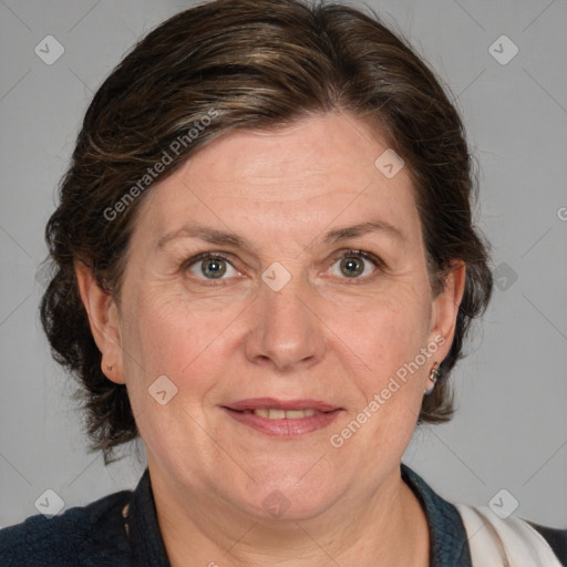 Joyful white adult female with medium  brown hair and grey eyes