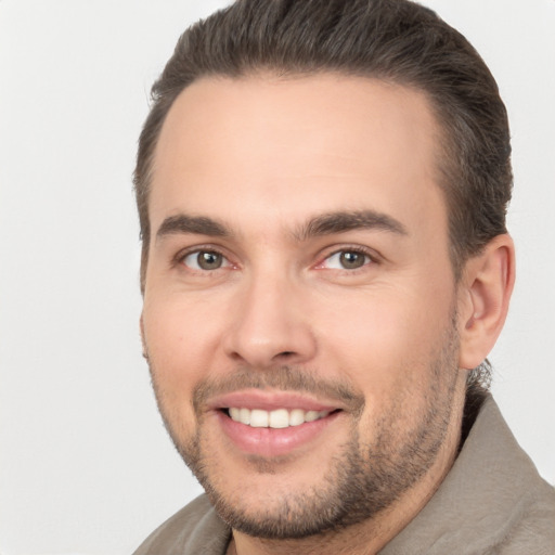 Joyful white young-adult male with short  brown hair and brown eyes