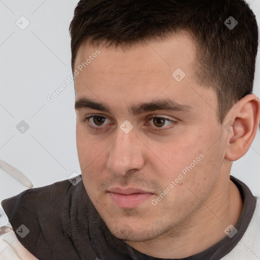 Neutral white young-adult male with short  brown hair and brown eyes