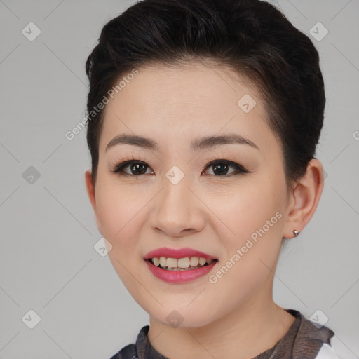 Joyful asian young-adult female with short  brown hair and brown eyes