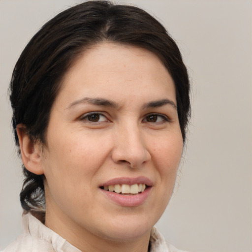 Joyful white young-adult female with medium  brown hair and brown eyes