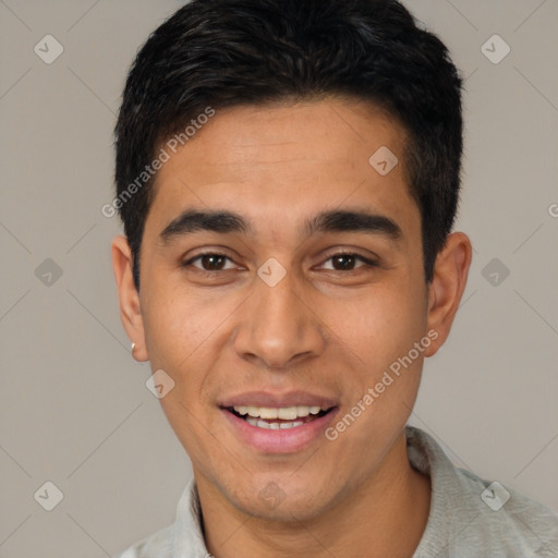 Joyful latino young-adult male with short  black hair and brown eyes